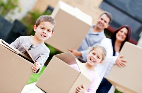 Professional movers handling boxes and furniture in central London