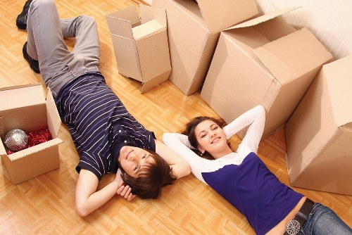 Dismantled office furniture and labelled boxes prepared for relocation